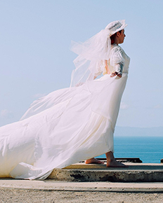 A bride in a ballgown wedding dress