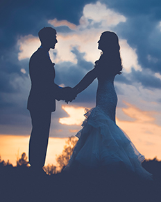 A bride in a fit and flare wedding dress