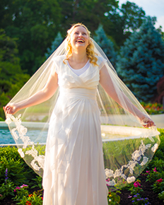 A bride in a sheath wedding dress